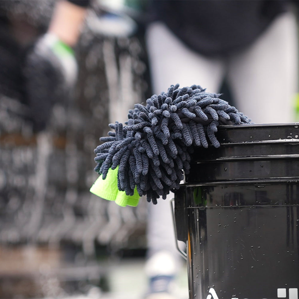 Caress microfibre car wash mitt in black wash bucket